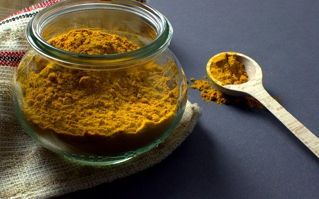 yellow-superfood-turmeric-powder-in-glass-jar-with-spoon